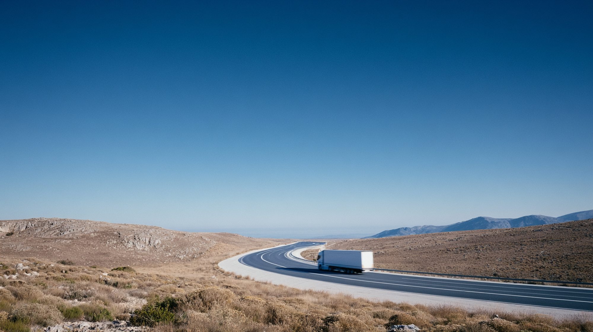 A truck on the road at first light